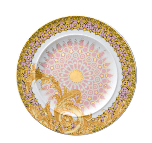 Piatto in porcellana decorata da cm.18 Marca: Versace Ricco decoro in oro e rosa su fondo bianco con filo in oro.